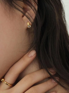 Elegant gold S925 sterling silver ball ring and zircon stud earrings set worn by model