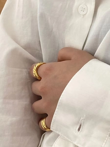 Minimalist double layer knot and croissant gold rings set for women on model