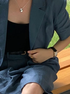 Minimalist S925 sterling silver teardrop necklace styled on a blue blazer outfit