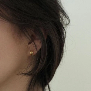 Minimalist double C-shaped gold hoop earrings for women in a modern stylish look