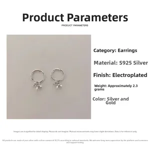 Détail macro de boucles d'oreilles chien ballon en argent S925 avec poids et placage