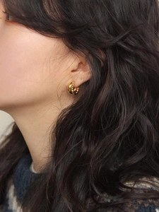 Elegant twisted gold hoop earrings for women in a minimalist 925 silver braided design