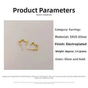 Macro shot of 925 sterling silver wavy earrings with smooth gold plating details