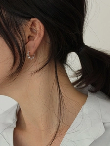 Elegant 925 sterling silver beaded hoop earrings worn for a minimalist and modern style