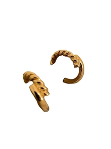 Twisted gold hoop earrings in a spiraling rope design with a polished metallic finish