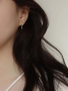Minimalist 925 sterling silver gold oval hoop earrings with sparkling zircon on model