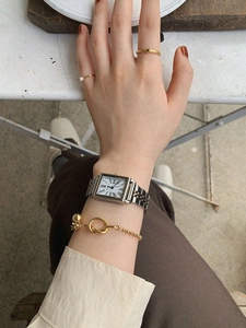 Vintage gold and silver rectangular watch with pearl ring and gold knot bracelet