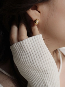 French vintage gold irregular round stud earrings with heart zirconia worn by female model