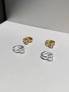 Detailed view of S925 silver hoop earrings with large round zircon in gold and silver