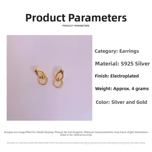 Detail of geometric S925 silver double hoop earrings with 18K gold plated texture