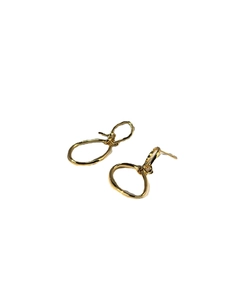 Artistic knotted gold earrings with irregular double loop design in polished finish