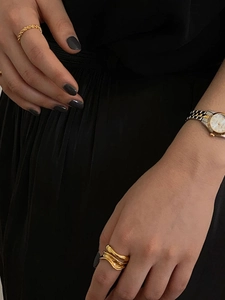 Minimalist double-layer irregular wave open ring in gold finish on model hand
