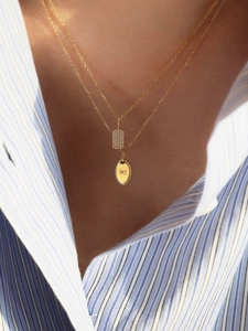 Double-layered S925 silver gold necklace with MJ initial pendant on a model