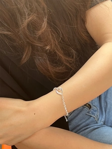 Minimalist 925 sterling silver chain bracelet featuring a hollow heart pendant for women