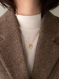 925 silver gold heart pendant necklace with sunburst texture and sparkling zircon on model