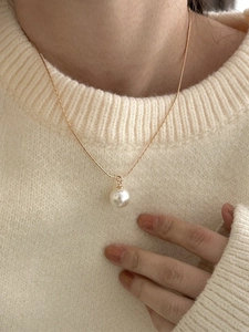 Minimalist 925 sterling silver necklace with single white pearl on golden snake chain
