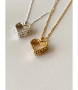 Detailed view of 925 sterling silver heart necklaces with Love ya engraving on side