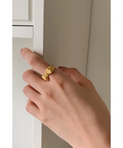 Elegant 925 sterling silver bow ring with golden silk texture finish on female hand