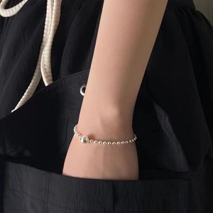 Minimalist 925 sterling silver beaded bracelet with a large central metal ball for women