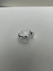 Detailed view of S925 sterling silver bow ring with classic twisted band and S925 stamp