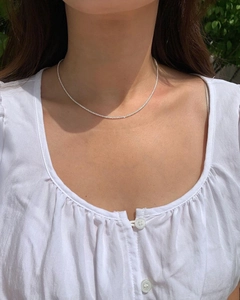 Minimalist S925 sterling silver sparkling shimmer chain necklace on female model