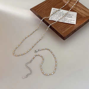 Detail of S925 sterling silver two-tone beaded necklace with adjustable lobster clasp