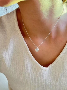 925 silver heart necklace with light blue stone and bead chain on neck