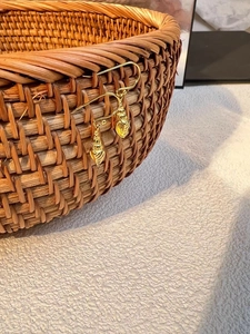 Elegant 925 sterling silver conch drop earrings in gold plating on woven basket