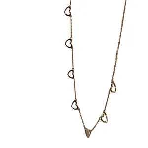 Chic 925 sterling silver heart necklace with five gold-tone open heart pendants