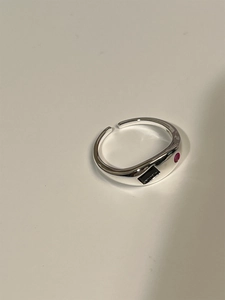Minimalist 925 sterling silver open ring with black and red gemstones on white background