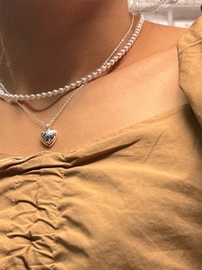 Collier double rang en argent S925 avec chaîne de perles et pendentif cœur poli élégant