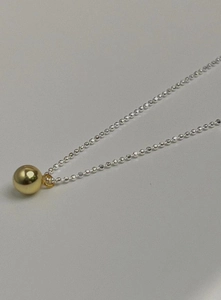 Minimalist 925 sterling silver necklace with a polished gold bead pendant on a bean chain