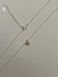 Minimalist 925 sterling silver beaded necklace with a golden spherical ball pendant
