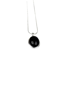 Elegant 925 sterling silver necklace featuring a black onyx oval pendant and snake chain