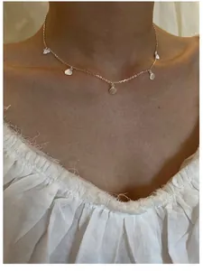 Minimalist S925 sterling silver choker featuring five delicate small shell pendants