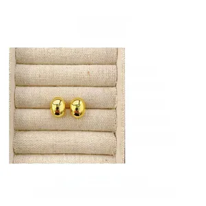 Detailed view of oval gold plated S925 sterling silver stud earrings weighing 3.4g