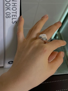 Polished 925 sterling silver chunky open ring with vertical striped texture on finger