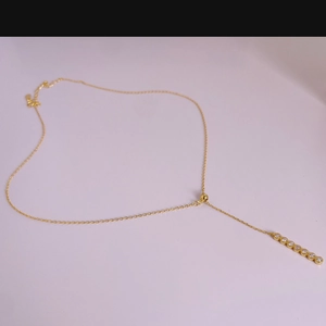 Detail of 925 sterling silver Y-shaped necklace with seven sparkling crystals