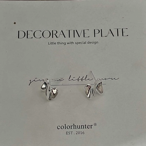 Close-up of S925 sterling silver twisted spiral earrings with a liquid metal texture
