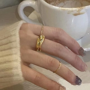 Minimalist 925 sterling silver golden ring set with irregular flowing texture on hands