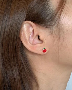 S925 silver cute red apple stud earrings with green leaf details on a female model