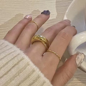 Minimalist 925 sterling silver gold ring set featuring a wide curved band and two slim rings