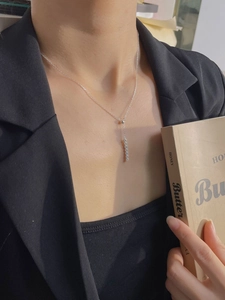 Minimalist 925 sterling silver vertical bar pendant necklace worn by a female model
