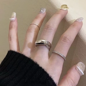 Close-up of 925 sterling silver curved ring set with fine rope and micro-pave bands