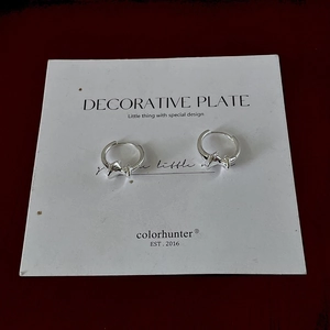 Detail of silver S925 irregular star hoop earrings with secure buckle closure