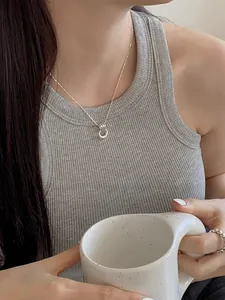 Minimalist S925 sterling silver double ring pendant necklace on a female model