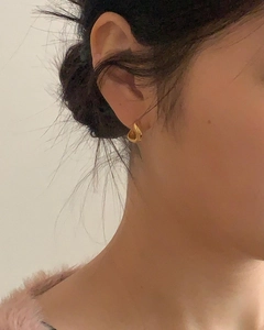 Polished 925 sterling silver golden twisted drop hoop earrings with minimalist design