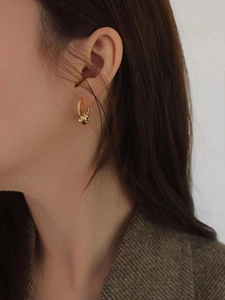 Irregular organic S925 sterling silver hoop earrings with a shiny gold lava texture finish