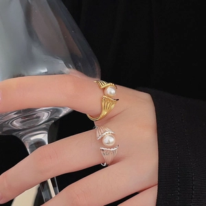 Detail of s925 silver pearl rings featuring an elegant mermaid tail design for women