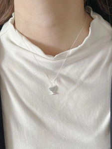 Detail of S925 sterling silver wine glass pendant necklace on model neck
